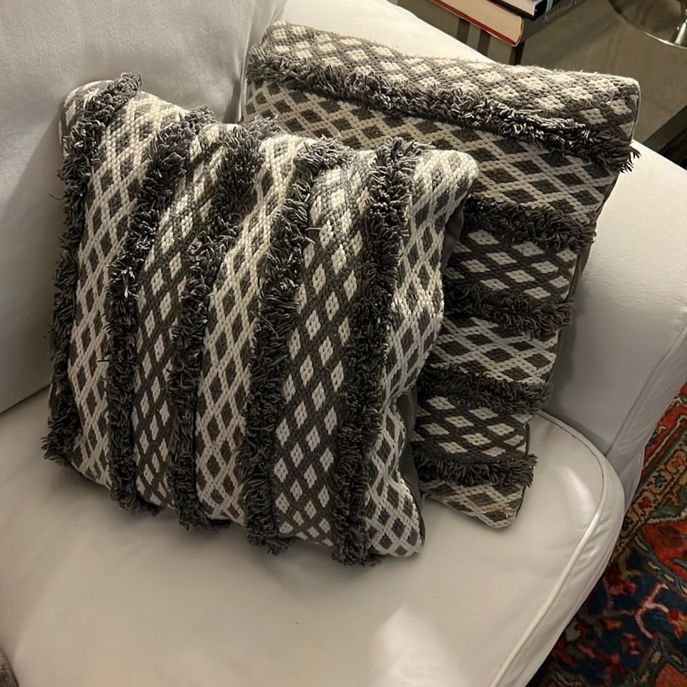 Gray and white HomeGoods couch pillows